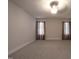 Spacious bedroom with neutral carpet, ample natural light, and a ceiling fan at 2109 Taramar Ln, Zebulon, NC 27597