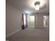 Bright bedroom featuring neutral carpet, a closet, and entryways on the side and at the back at 2109 Taramar Ln, Zebulon, NC 27597