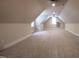 Spacious bonus room with carpet and two windows for natural light at 2109 Taramar Ln, Zebulon, NC 27597