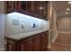 Spacious butler's pantry features granite counters, dark wood cabinets, and plenty of storage at 2109 Taramar Ln, Zebulon, NC 27597