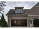 Attached garage with storage racks, a door, and additional space for storage and activities at 2109 Taramar Ln, Zebulon, NC 27597