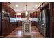 Beautiful kitchen features stainless steel appliances, granite counters, and hardwood floors at 2109 Taramar Ln, Zebulon, NC 27597