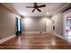 A spacious living room with hardwood floors and natural light, offering a warm and inviting space for relaxation and entertainment at 2109 Taramar Ln, Zebulon, NC 27597