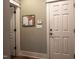 Mud room features the back door, a cork board, and a door to another room at 2109 Taramar Ln, Zebulon, NC 27597