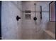 Tiled shower with a shower head, handheld sprayer, and built-in seat at 2109 Taramar Ln, Zebulon, NC 27597