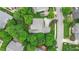 Aerial view of the house showcasing its beautiful landscaping, mature trees, and its position in a quiet neighborhood at 220 Cole Valley Dr, Cary, NC 27513