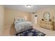 Cozy bedroom with a comfortable bed, carpeted floor, and decorative mirror, creating a relaxing atmosphere at 220 Cole Valley Dr, Cary, NC 27513