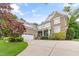 Charming two-story brick home with a well-manicured lawn and ample parking space at 220 Cole Valley Dr, Cary, NC 27513