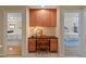 Hallway desk area with built-in cabinets, drawers, and a chair, connecting two bedrooms at 220 Cole Valley Dr, Cary, NC 27513