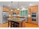 Spacious kitchen with granite countertops, stainless steel appliances, and large island at 220 Cole Valley Dr, Cary, NC 27513
