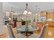 Interior shot of living room featuring fireplace, sitting area, and access to the kitchen at 220 Cole Valley Dr, Cary, NC 27513