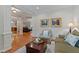 Inviting living room with hardwood floors, comfortable seating, and views into adjoining rooms at 220 Cole Valley Dr, Cary, NC 27513