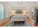 Spacious main bedroom featuring a tray ceiling, chandelier, and ensuite bathroom at 220 Cole Valley Dr, Cary, NC 27513