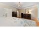 Spacious main bedroom featuring a white comforter and dark wooden dressers at 220 Cole Valley Dr, Cary, NC 27513