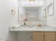 Bathroom featuring a marble countertop, large mirror, and updated fixtures at 2201 Alpine Rd, Durham, NC 27707