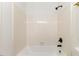 Bathroom with combined tub and shower featuring updated fixtures and hardware at 2201 Alpine Rd, Durham, NC 27707