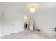 Cozy bedroom with large windows, decorative rug, and modern chandelier at 2201 Alpine Rd, Durham, NC 27707