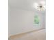 Spacious bedroom featuring neutral paint, plush carpet, and modern lighting fixture at 2201 Alpine Rd, Durham, NC 27707