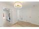 Bright entrance hallway with a chandelier and plenty of closet space adjacent to the entrance at 2201 Alpine Rd, Durham, NC 27707
