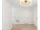 Bright entrance hallway with a chandelier and plenty of closet space adjacent to the entrance at 2201 Alpine Rd, Durham, NC 27707