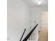 Upstairs hallway with wood flooring and white walls at 2201 Alpine Rd, Durham, NC 27707