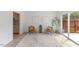 Bright living room featuring a sliding glass door, neutral paint, and decorative rug at 2201 Alpine Rd, Durham, NC 27707