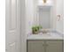 Bathroom features marble vanity, brass fixtures, and a decorative mirror at 2201 Alpine Rd, Durham, NC 27707
