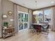 Bright dining area with sliding door to patio, modern table set, and stylish decorations at 221 Steel Springs Ln # 23, Angier, NC 27501