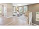 Cozy upstairs sitting area with sofa, natural lighting, and play tent at 221 Steel Springs Ln # 23, Angier, NC 27501