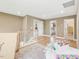 Bright hallway area featuring hardwood floors, natural lighting, and access to multiple bedrooms at 221 Steel Springs Ln # 23, Angier, NC 27501
