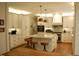 Bright kitchen with marble countertops, island with seating, stainless steel appliances, and custom cabinets at 2216 Countrywood North Rd, Raleigh, NC 27615