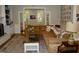 Cozy living room featuring a comfortable sofa, decorative rug, fireplace, and inviting decor at 2216 Countrywood North Rd, Raleigh, NC 27615