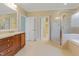 Spacious bathroom with double sinks, walk-in shower, and separate water closet at 225 Norwalk St, Holly Springs, NC 27540