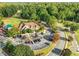 Beautiful clubhouse at golf course with parking, trees, and manicured grounds at 225 Norwalk St, Holly Springs, NC 27540