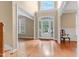 Bright foyer with hardwood floors, high ceilings, and a view to the front yard at 225 Norwalk St, Holly Springs, NC 27540