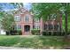 Stately brick home with manicured lawn and mature trees offering classic curb appeal at 225 Norwalk St, Holly Springs, NC 27540