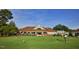Scenic view of the golf course with putting green and clubhouse in background at 225 Norwalk St, Holly Springs, NC 27540