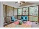 Relaxing screened porch featuring comfortable seating, colorful rug, and string lights at 225 Norwalk St, Holly Springs, NC 27540