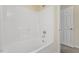 Bright white tub shower and white door in bathroom at 229 Michigan Ave, Cary, NC 27519