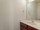 Powder room featuring a single vanity with marble countertop and a mirror at 229 Michigan Ave, Cary, NC 27519