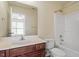Bathroom including single sink vanity with a mirror and walk-in shower and tub at 229 Michigan Ave, Cary, NC 27519