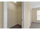 Walk-in closet features wire shelving for storage; view to bedroom at 229 Michigan Ave, Cary, NC 27519
