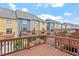 Rear exterior view of townhomes with private decks and attached garages at 229 Michigan Ave, Cary, NC 27519