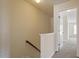 Hallway with a view from the stairs and an entrance into a room at 229 Michigan Ave, Cary, NC 27519