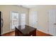 Open breakfast nook with access to back porch from double doors, with an island at 229 Michigan Ave, Cary, NC 27519