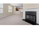 Open concept living room with fireplace and view to the kitchen and dining area at 229 Michigan Ave, Cary, NC 27519