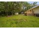 Expansive backyard with a fire pit, shed, and deck, ideal for outdoor enjoyment at 231 Harris Rd, Smithfield, NC 27577