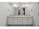 Well-lit bathroom with double sinks, ample counter space, and a large mirror at 231 Harris Rd, Smithfield, NC 27577