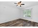 Bedroom featuring wood-look flooring, bright window, and neutral color palette at 231 Harris Rd, Smithfield, NC 27577