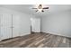 Bedroom featuring neutral colors, wood-look flooring, and closet space at 231 Harris Rd, Smithfield, NC 27577